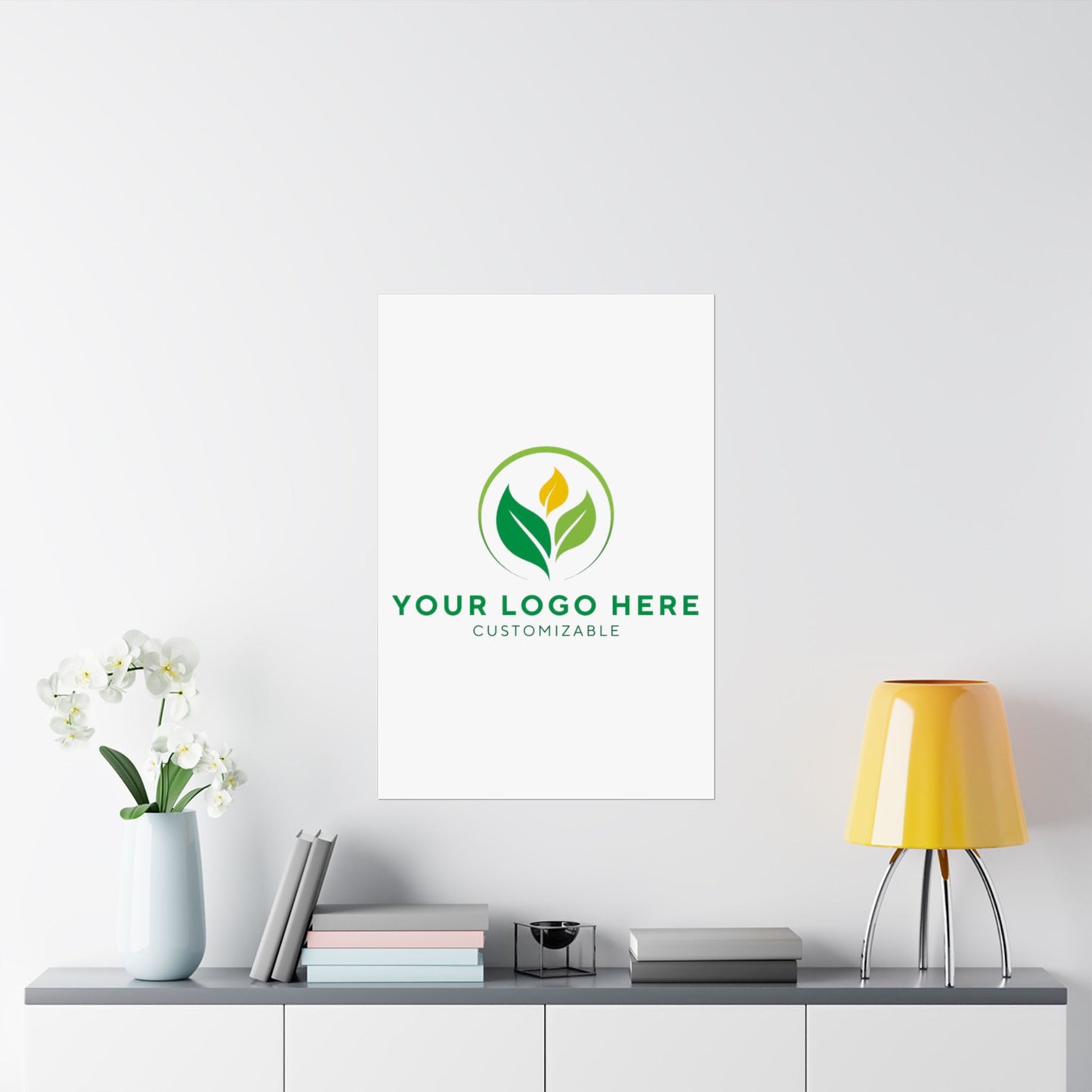 Framed customizable logo on a wall above a shelf with decor items.