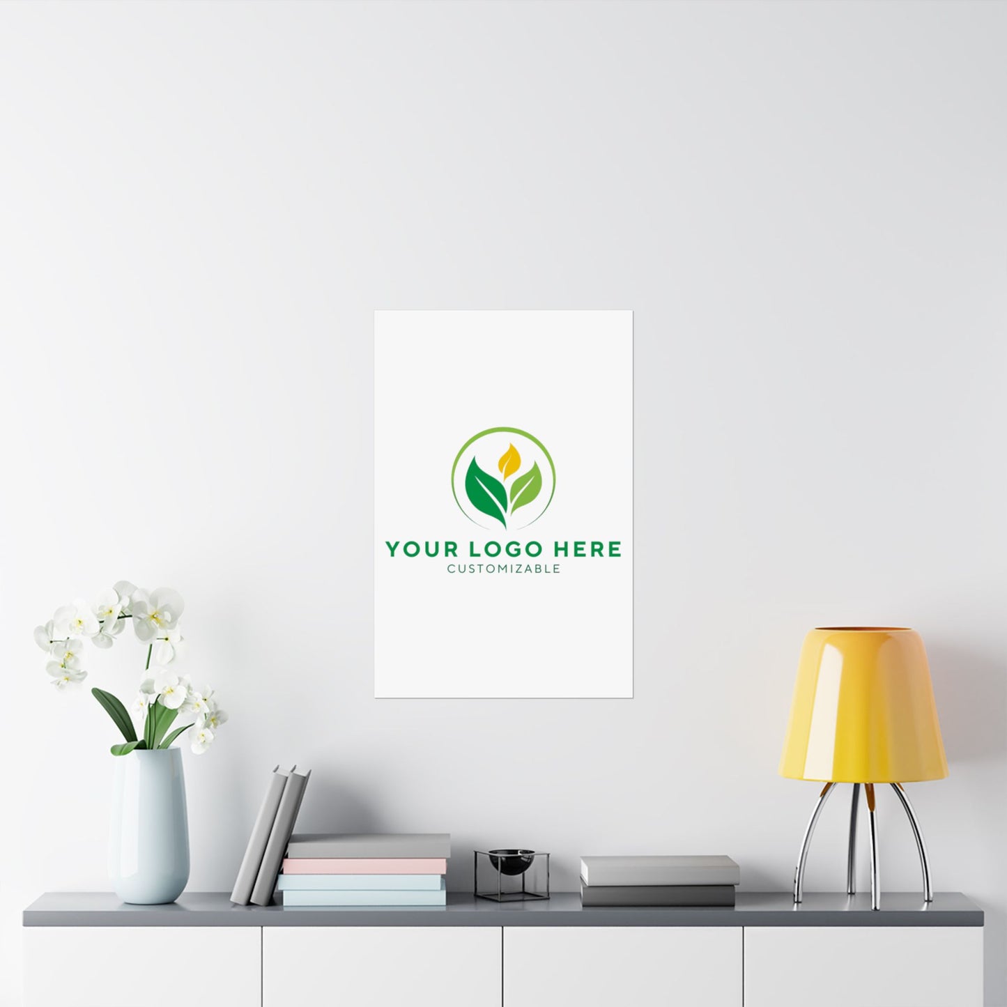 Framed customizable logo on a wall above a table with decor items.