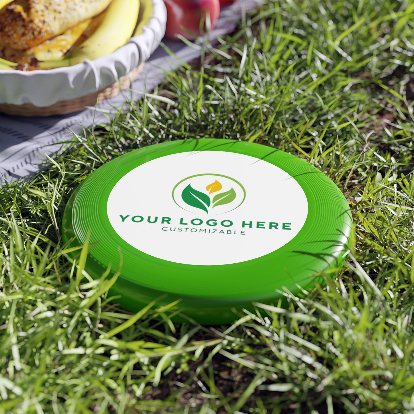 Green disc with customizable logo on grass