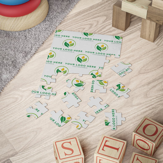 Customizable puzzle pieces with a logo on a wooden surface with toy blocks.