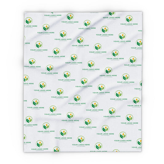 White blanket with green logo pattern on a white background