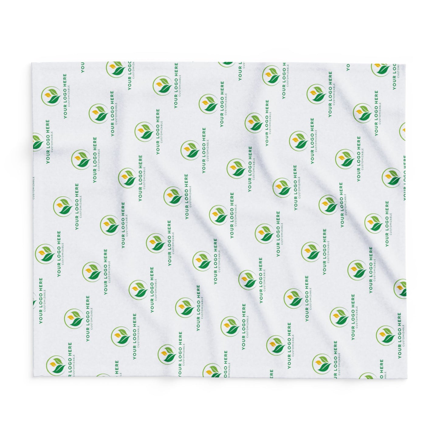 White blanket with green and yellow logo pattern on a white background