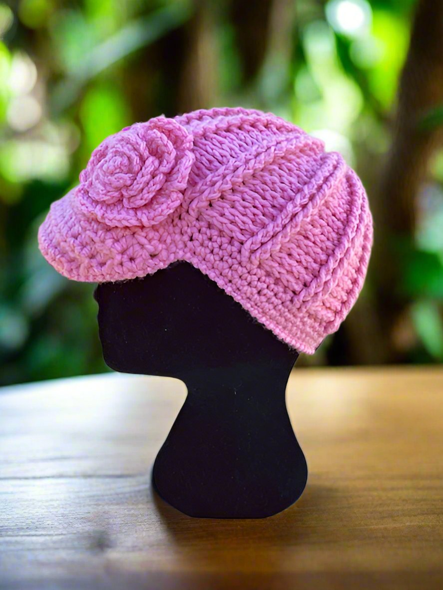side view of crochet flower girl hat, pink