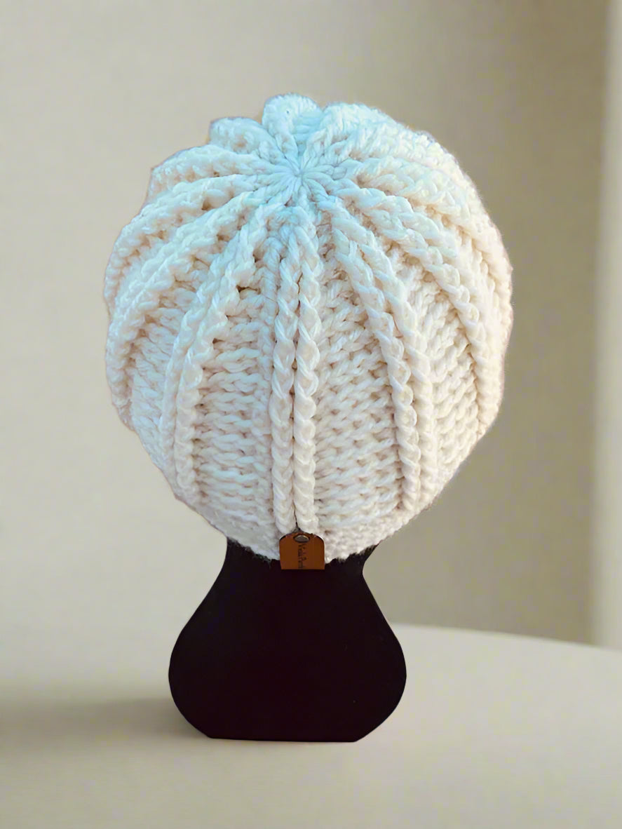 back of a mannequin head with white hat on
