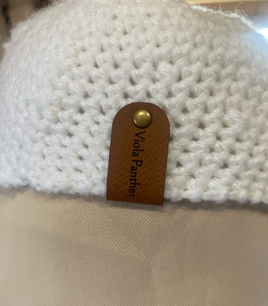 close up of tag on newsboy cap