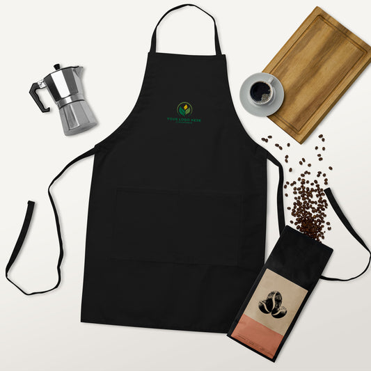 Black apron with a logo on a white background with coffee-themed items.