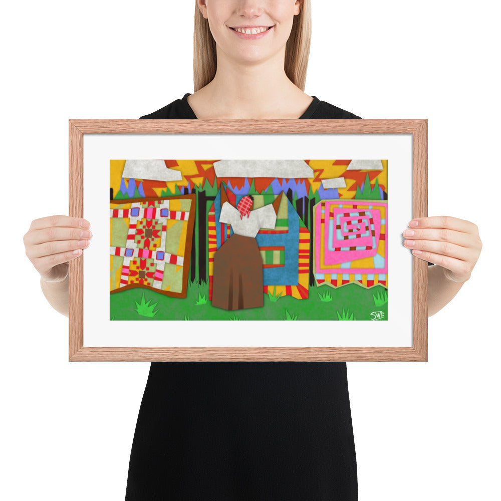 Gee’s Bend inspired framed poster with colorful quilts hanging on a line outdoors