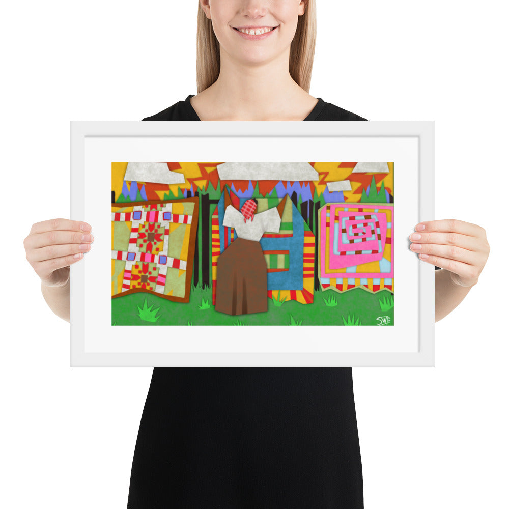 Gee’s Bend inspired framed poster with colorful quilts hanging on a line outdoors