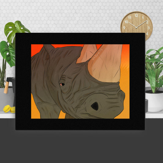 A grayscale canvas print of a white rhino in sharp detail, its massive body and textured skin captured mid-step, symbolizing strength and quiet resilience.