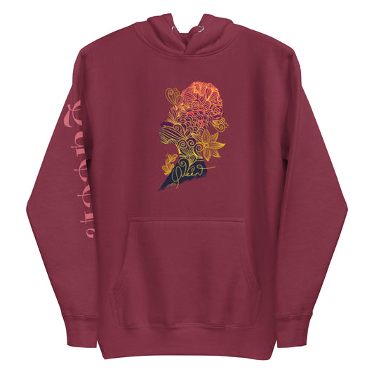 A maroon-colored long-sleeve women's hoodie with a graphic design of a stylized woman's face and flowers on the front.