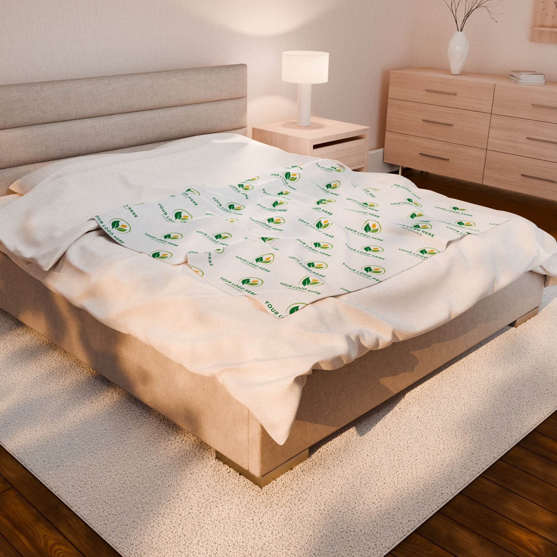 Bed with white bedding featuring avocado patterns in a bedroom setting.