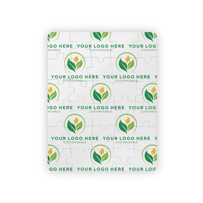 Customizable logo puzzle with green leaf design on a white background