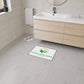 Bathroom with a custom logo mat on the floor, ready for branding.