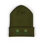 Green beanie with embroidered logos on a white background