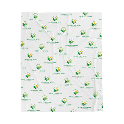 White blanket with green and yellow logo pattern for branding
