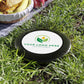 Customizable disc with a logo on grass, ready for branding.