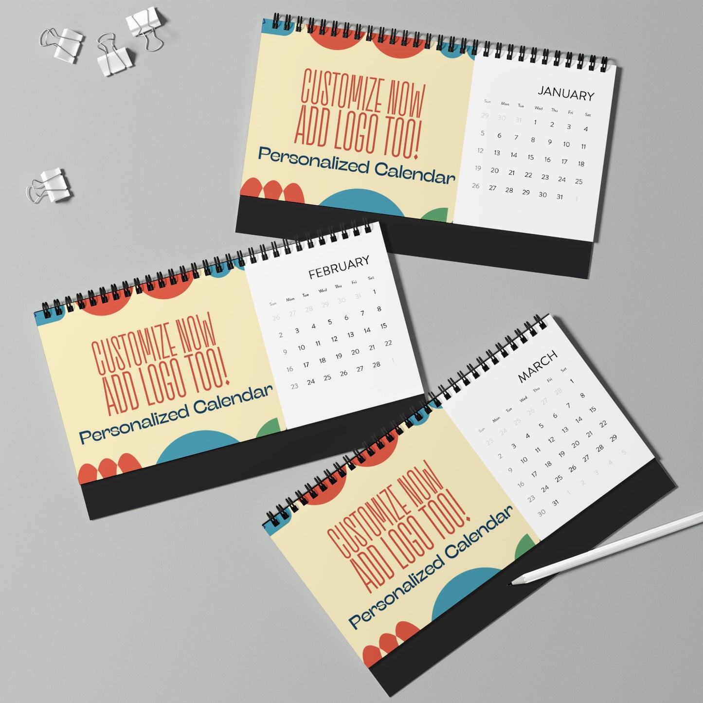 Three personalized calendar books with a focus on customization options on a gray background.