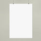 Blank white poster on a light gray wall
