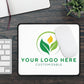 Customizable mouse pad with a leaf logo on a wooden desk.