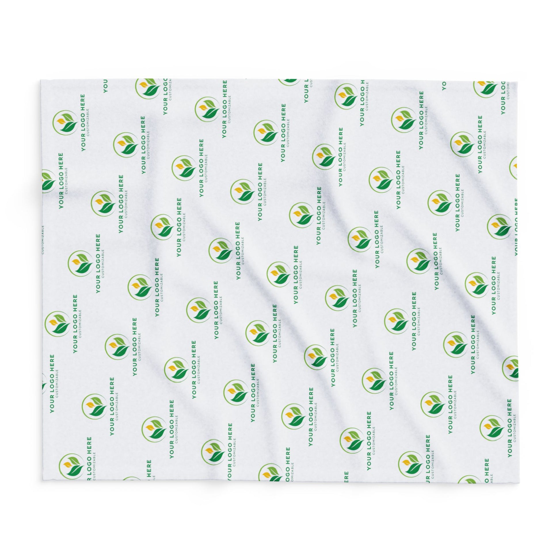 White blanket with green and yellow logo pattern on a white background