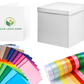 Colorful paper and ribbons with a branded box on a white background