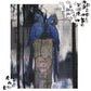 Jigsaw puzzle with two blue parrots on a tree stump in a forest setting