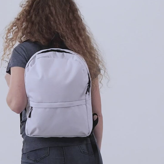 White backpack with customizable logo design on a white background