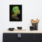 A canvas print titled 'King' displayed on a wall above a kitchen counter, featuring a stylized graphic with yellow and green on a black background.
