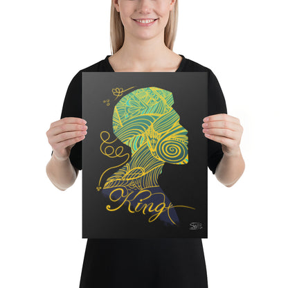 woman holding smaller canvas print featuring a stylized, colorful illustration of a human head with decorative elements, titled 'KING' at the bottom.